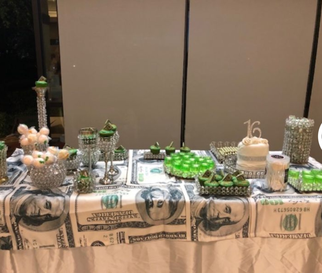 Sweet Sixteen money-themed dessert table in green and silver